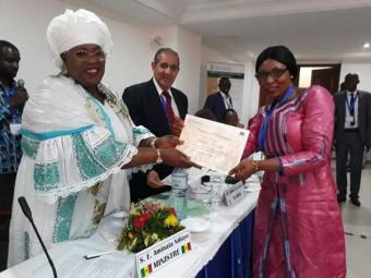 © 2017 AU-IBAR/Aminata Diakite (right) from Mali receiving her certificate from Minister of Livestock and Animal Production of Senegal (left) and The Director of AU-IBAR (centre).